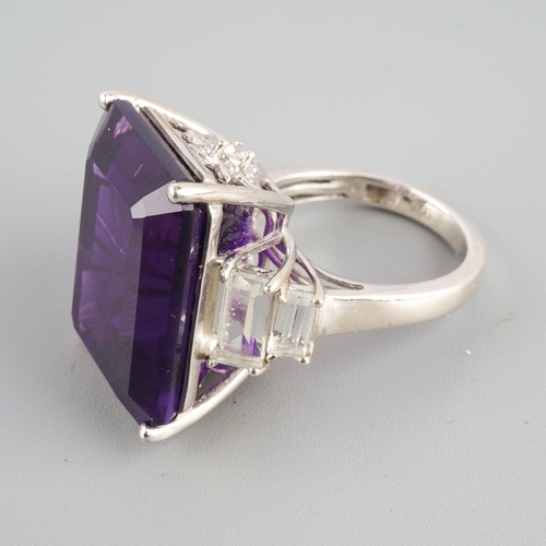 954 - An amethyst single stone ring. Stamped 925, approx ring size L, approx gross weight 9.69 grams.