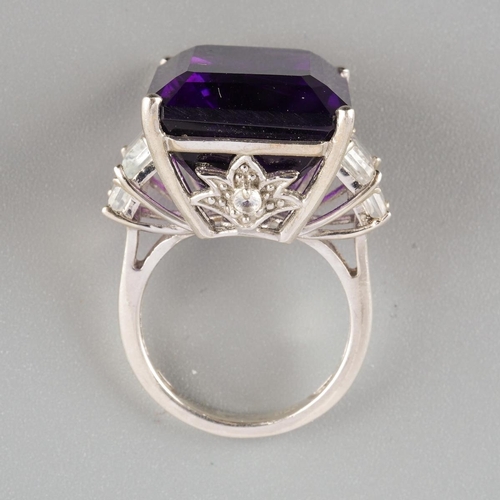 954 - An amethyst single stone ring. Stamped 925, approx ring size L, approx gross weight 9.69 grams.