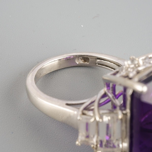 954 - An amethyst single stone ring. Stamped 925, approx ring size L, approx gross weight 9.69 grams.
