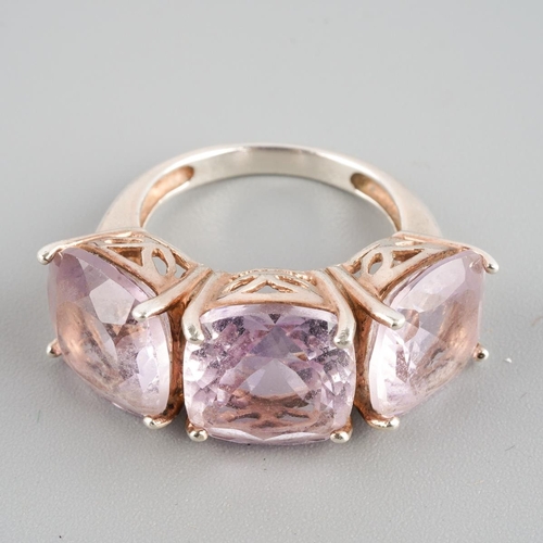 955 - An amethyst three stone ring. Stamped 925 S, approx ring size M, approx gross weight 6.19 grams.