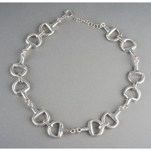 957 - A silver horse bit necklace. Stamped 925, approx length 580mm, approx gross weight 55.86 grams.