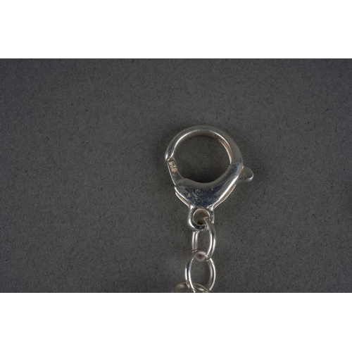 957 - A silver horse bit necklace. Stamped 925, approx length 580mm, approx gross weight 55.86 grams.