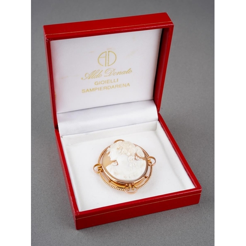 974 - A 9ct cameo brooch brooch. The shell cameo carved to depict a Bacchante stamped 9ct, makers mark W.N... 