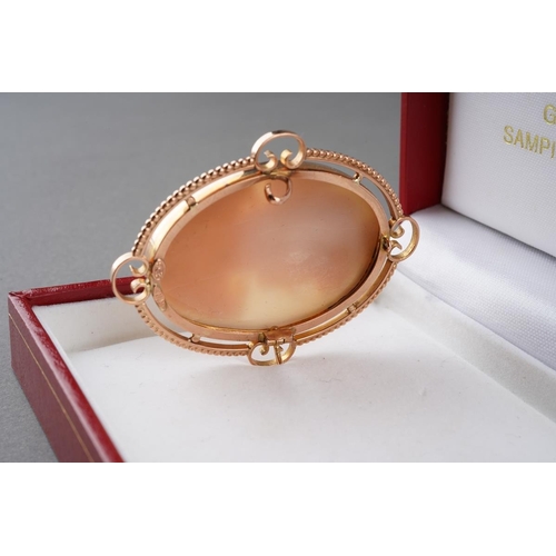 974 - A 9ct cameo brooch brooch. The shell cameo carved to depict a Bacchante stamped 9ct, makers mark W.N... 