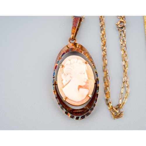 978 - A shell cameo pendant and two chains. Pendant and one chain hallmarked 9ct gold, one chainstamped 37... 
