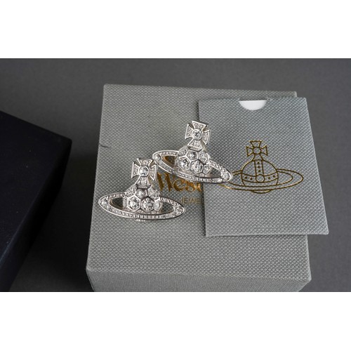 882 - A collection of designer items to include Vivienne Westwood and Chanel. Each with designer case. Nec... 