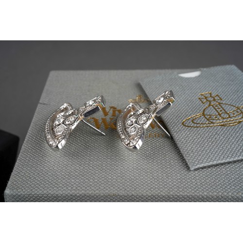 882 - A collection of designer items to include Vivienne Westwood and Chanel. Each with designer case. Nec... 