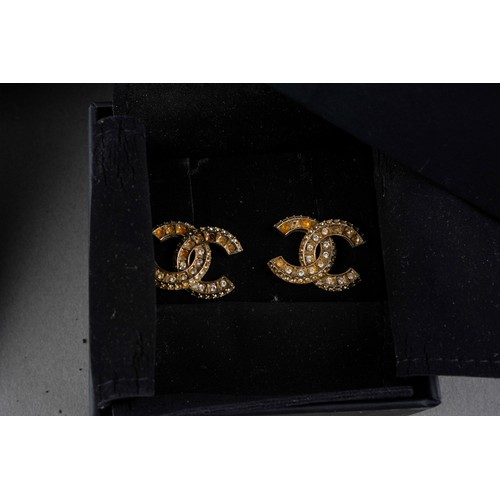 882 - A collection of designer items to include Vivienne Westwood and Chanel. Each with designer case. Nec... 