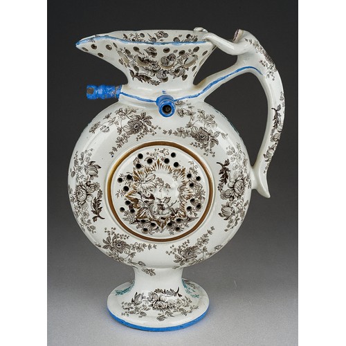 242 - An early 19th Century transfer printed puzzle jug, the circular flask form centred by a raised sun m... 