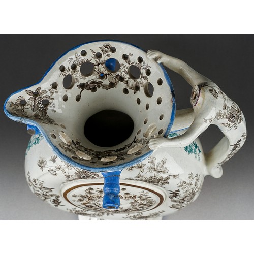 242 - An early 19th Century transfer printed puzzle jug, the circular flask form centred by a raised sun m... 