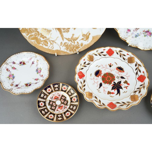 273 - Five assorted Royal Crown Derby plates and two Royal Crown Derby 2451 pattern saucers, the plate pat... 