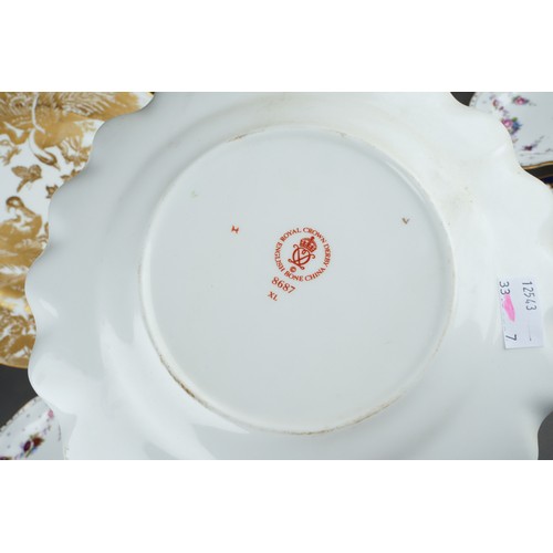 273 - Five assorted Royal Crown Derby plates and two Royal Crown Derby 2451 pattern saucers, the plate pat... 