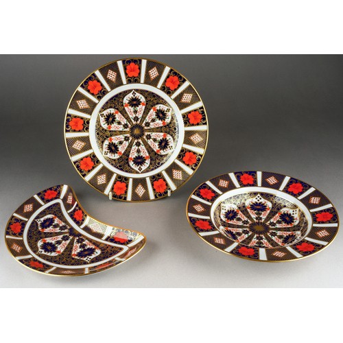286 - Three pieces of Royal Crown Derby 1128 Imari, comprising a crescent shaped salad plate, a soup plate... 