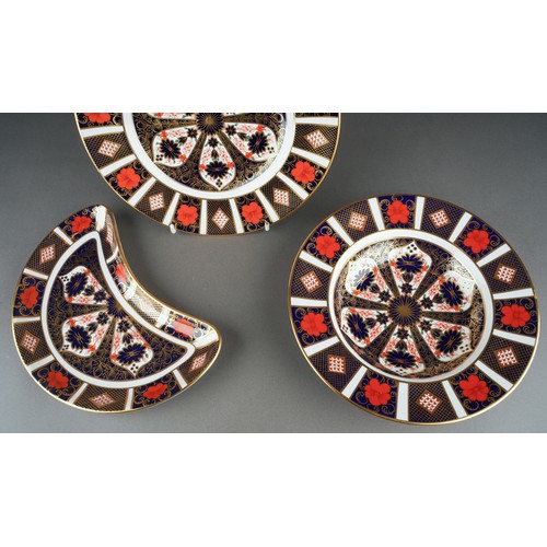 286 - Three pieces of Royal Crown Derby 1128 Imari, comprising a crescent shaped salad plate, a soup plate... 