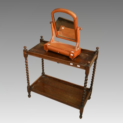 426 - A 1920s oak two tier tea trolley and a late victorian satin walnut toilet mirror with draw to base (... 