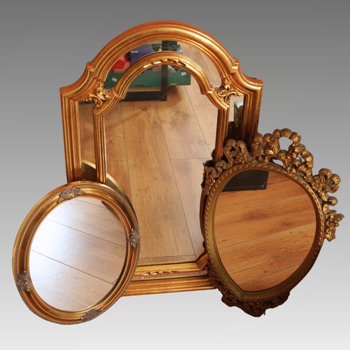 564 - Three modern gilt framed wall mirrors, the largest of arched form with inner gilt divisions, overall... 