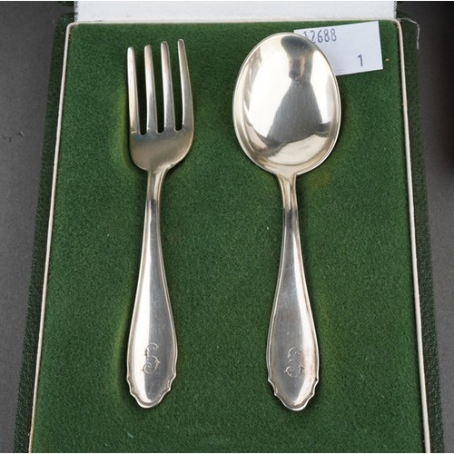 647 - A collection of silver to include two Christening cups, a Christening spoon and fork set, a seal sta... 