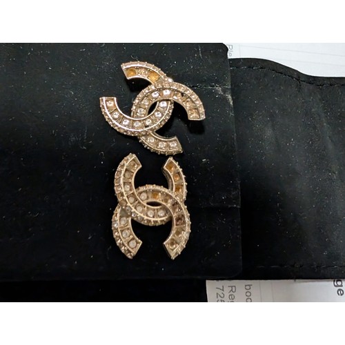 882 - A collection of designer items to include Vivienne Westwood and Chanel. Each with designer case. Nec... 