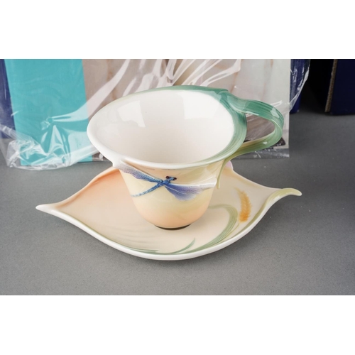 6 - Two boxed Franz Porcelain cups and saucer including Blossom-Iris including spoon, FZ02080E and Drago... 