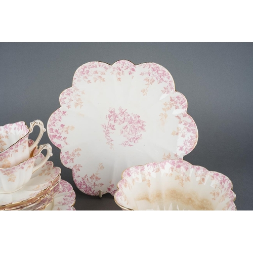 12 - A twenty one piece Wileman & Co Foley China tea set in the 5042 Empire shape, pink and beige printed... 