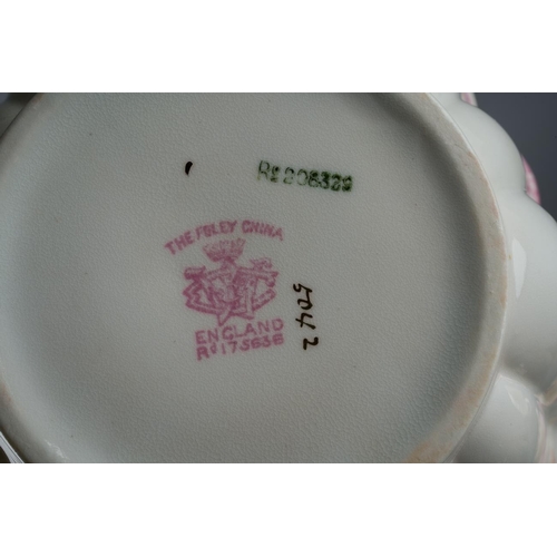 12 - A twenty one piece Wileman & Co Foley China tea set in the 5042 Empire shape, pink and beige printed... 