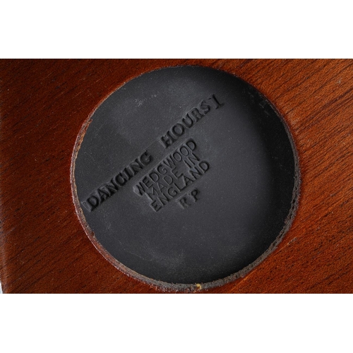 27 - A framed Wedgwood black basalt Dancing Hours rectangular plaque, within a velvet mount and gilt fram... 