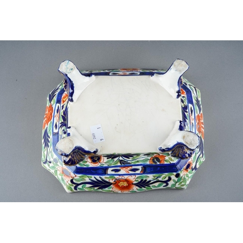 46 - An early 19th Century stoneware rectangular bowl, shaped rim on scroll feet, approx 26cm long [1]