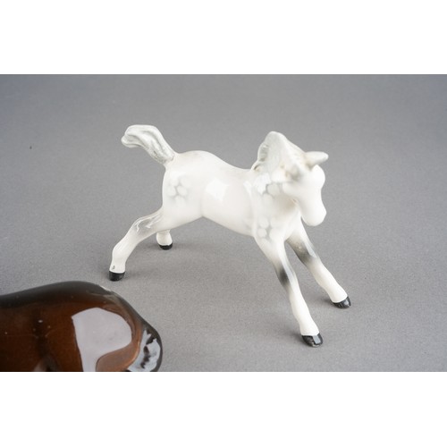 59 - A Beswick Brown foal, model no 915, impressed marks together with a Beswick Dapple [Rocking Horse] G... 