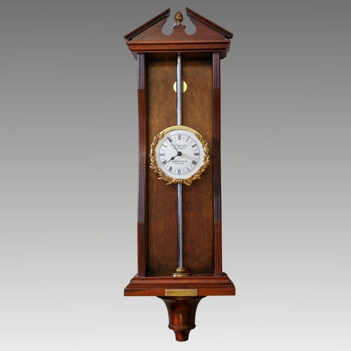 A reproduction limited edition mahogany cased gravity / rack clock ...