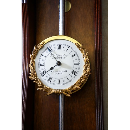 A reproduction limited edition mahogany cased gravity / rack clock ...
