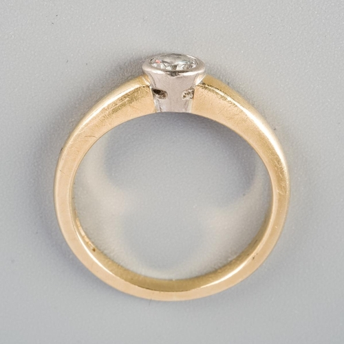 An 18ct gold diamond single stone ring. Set with a round brilliant cut ...