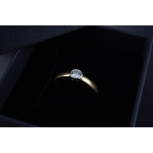 An 18ct gold diamond single stone ring. Set with a round brilliant cut ...