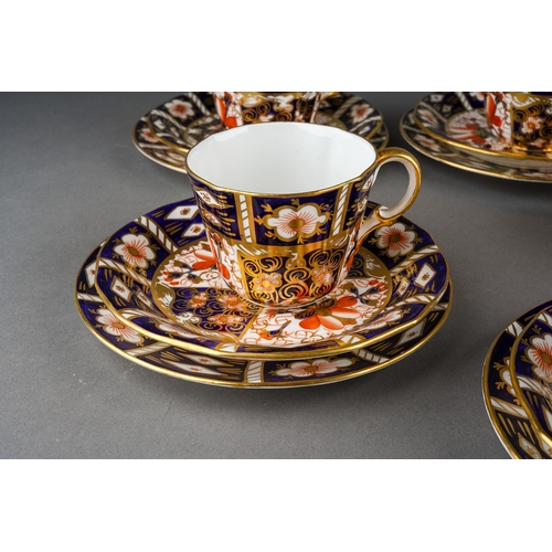 12 - A Royal Crown Derby Imari 2451 pattern nineteen piece tea set, comprising six trios and a sugar bowl... 