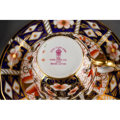 12 - A Royal Crown Derby Imari 2451 pattern nineteen piece tea set, comprising six trios and a sugar bowl... 