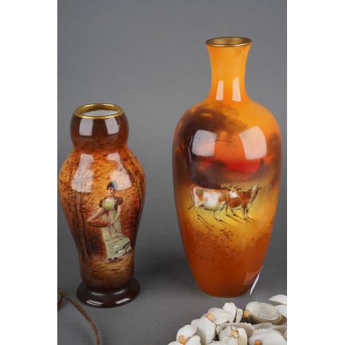 19 - An early 20th Century baluster vase, the body painted with a pair of cows with trees beyond signed W... 