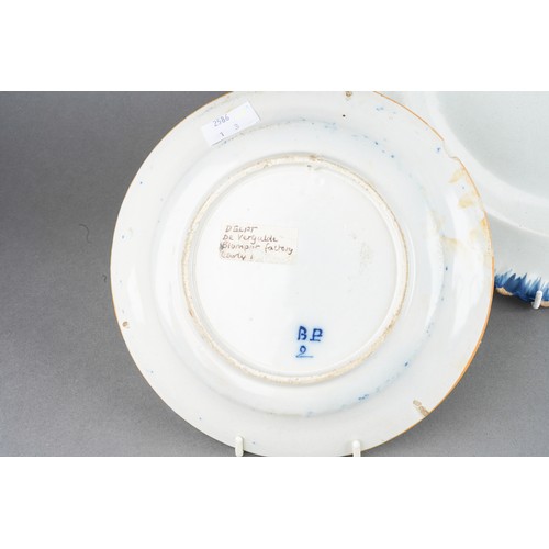 20 - An 18th Century Delft blue and white Peacock, underglaze marks to underside, approx 24cm diam togeth... 