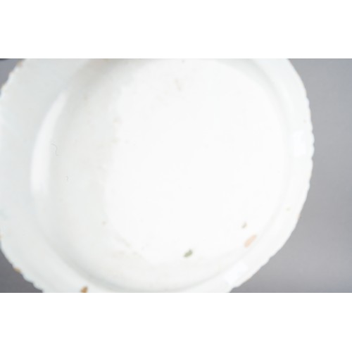 20 - An 18th Century Delft blue and white Peacock, underglaze marks to underside, approx 24cm diam togeth... 