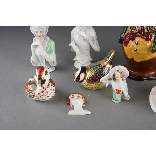 23 - A Foley Intarsio toby jug of a man holding a club, number 3460 and printed marks to base, glued repa... 