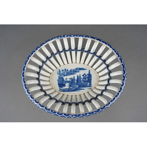 28 - Late 19th century creamware and blue and white transfer print chestnut basket measuring approximatel... 