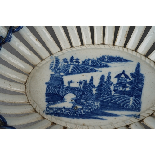 28 - Late 19th century creamware and blue and white transfer print chestnut basket measuring approximatel... 