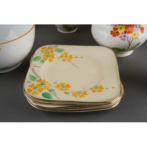 53 - A Grafton China pattern 5459 tea service decorated with primula in various colours comprising cake p... 