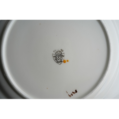 53 - A Grafton China pattern 5459 tea service decorated with primula in various colours comprising cake p... 