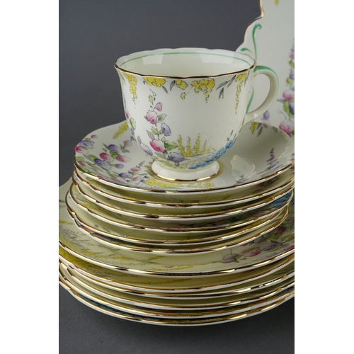 55 - A Foley China 1930s style six piece tea set decorated with flowers to include six cups, saucers, pla... 