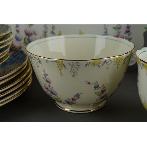 55 - A Foley China 1930s style six piece tea set decorated with flowers to include six cups, saucers, pla... 