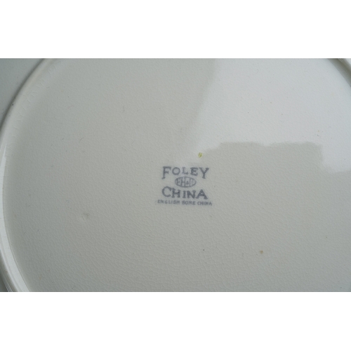 55 - A Foley China 1930s style six piece tea set decorated with flowers to include six cups, saucers, pla... 