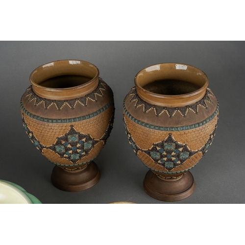 62 - A pair of Doulton Lambeth Silicon ware vases, impressed mark and numbered 1884, approx 18cm high tog... 