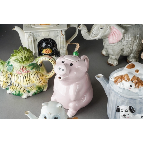 66 - A collection of assorted novelty teapots including Penguin, Carousel Horse, Elephant, Pigs etc [1 bo... 