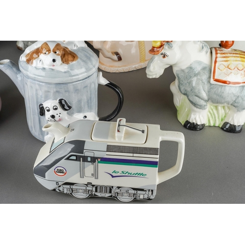 66 - A collection of assorted novelty teapots including Penguin, Carousel Horse, Elephant, Pigs etc [1 bo... 