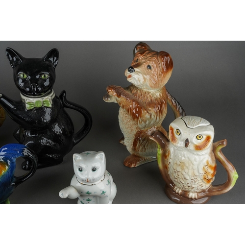 67 - A collection of novelty teapots including Black Cat, Camel, Panda, Dog, Owl, Cats, various factories... 