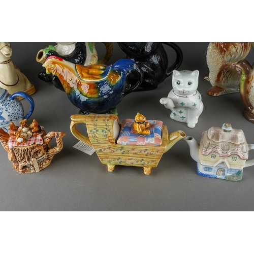 67 - A collection of novelty teapots including Black Cat, Camel, Panda, Dog, Owl, Cats, various factories... 